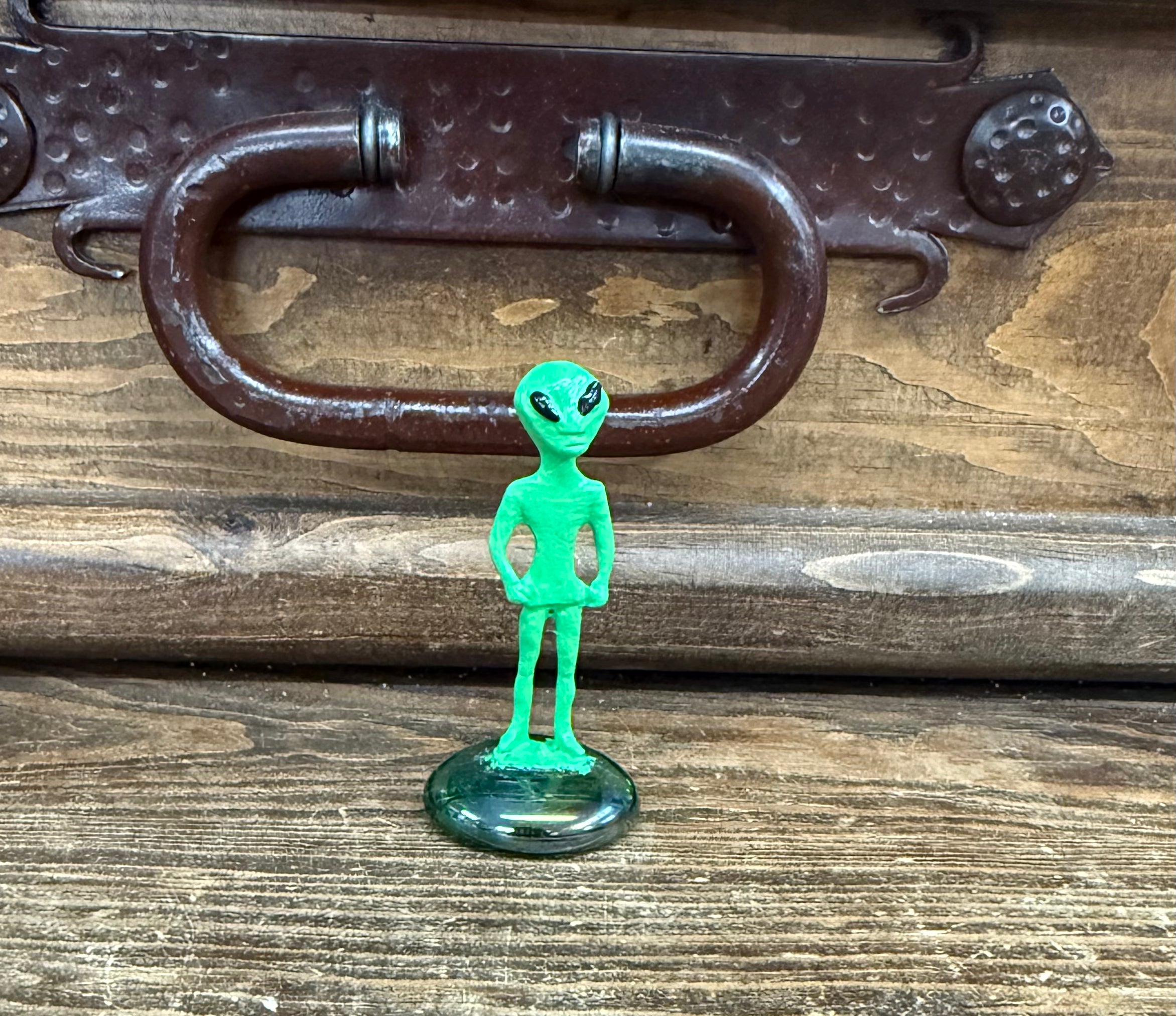 Pewter alien on marble