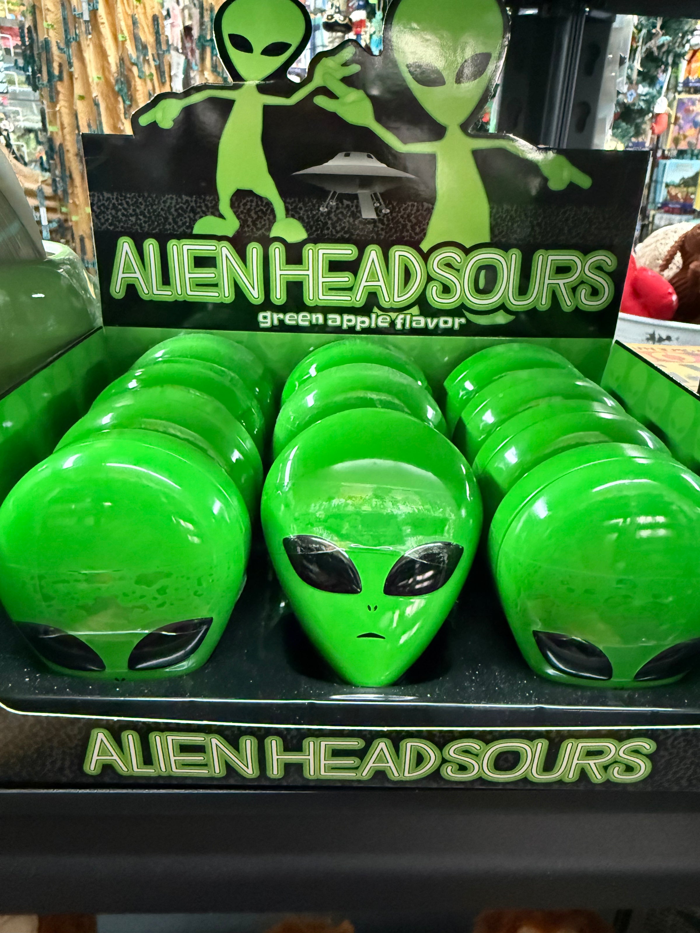 Alien head sour candy tin