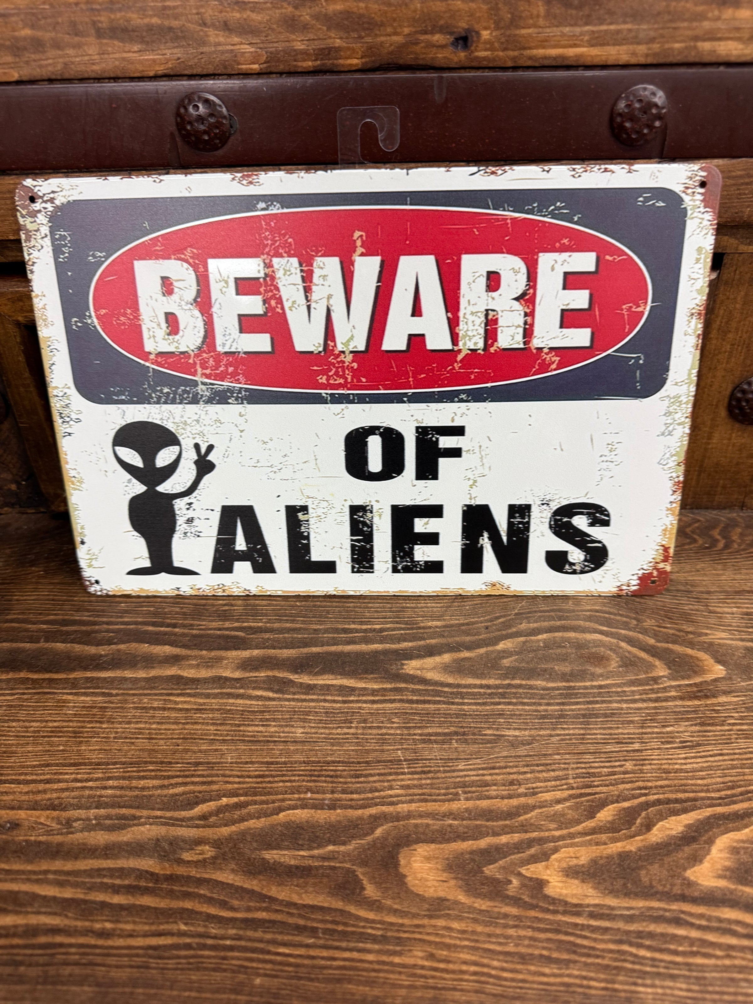 Alien metal sign