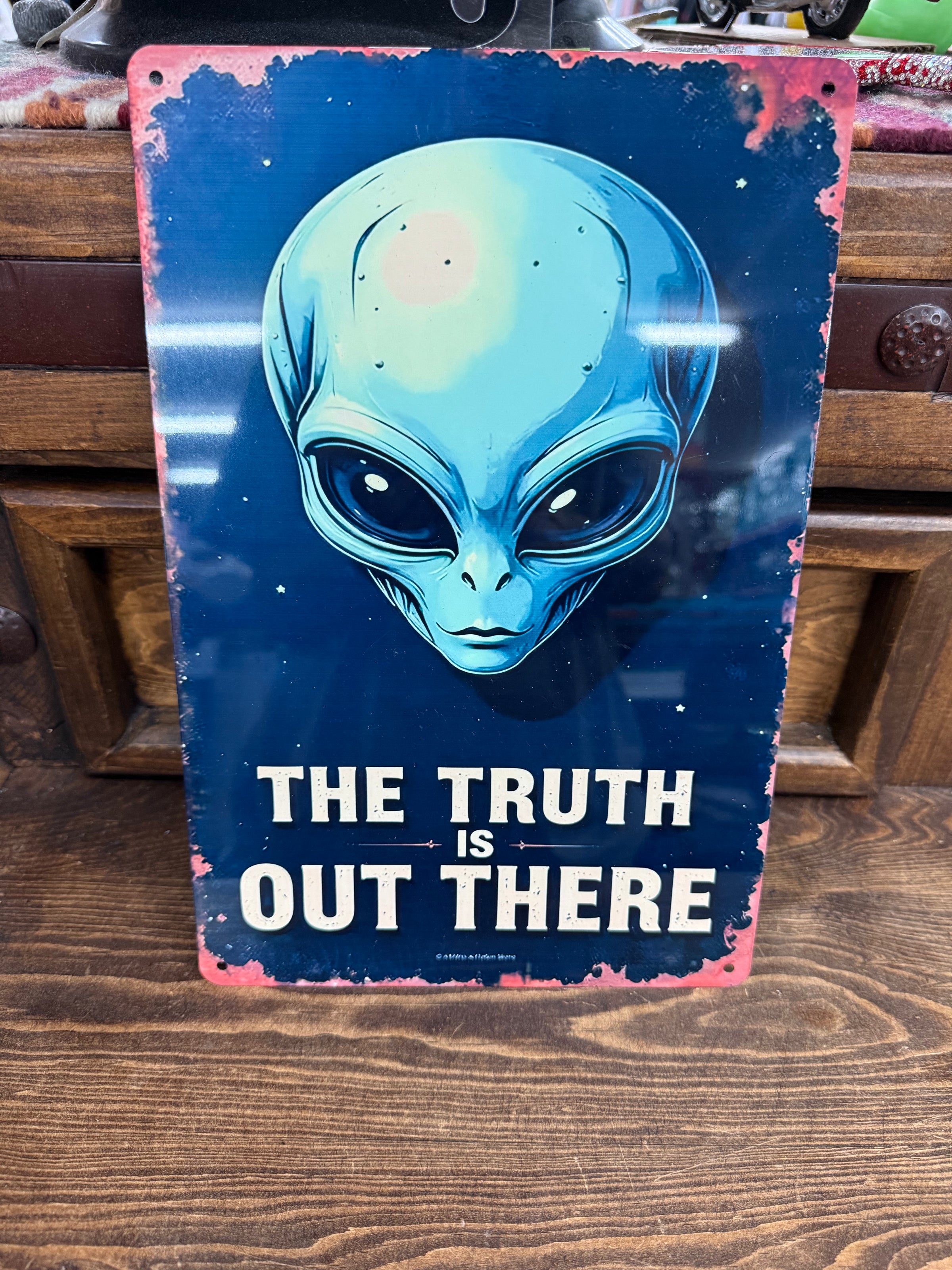Alien metal sign